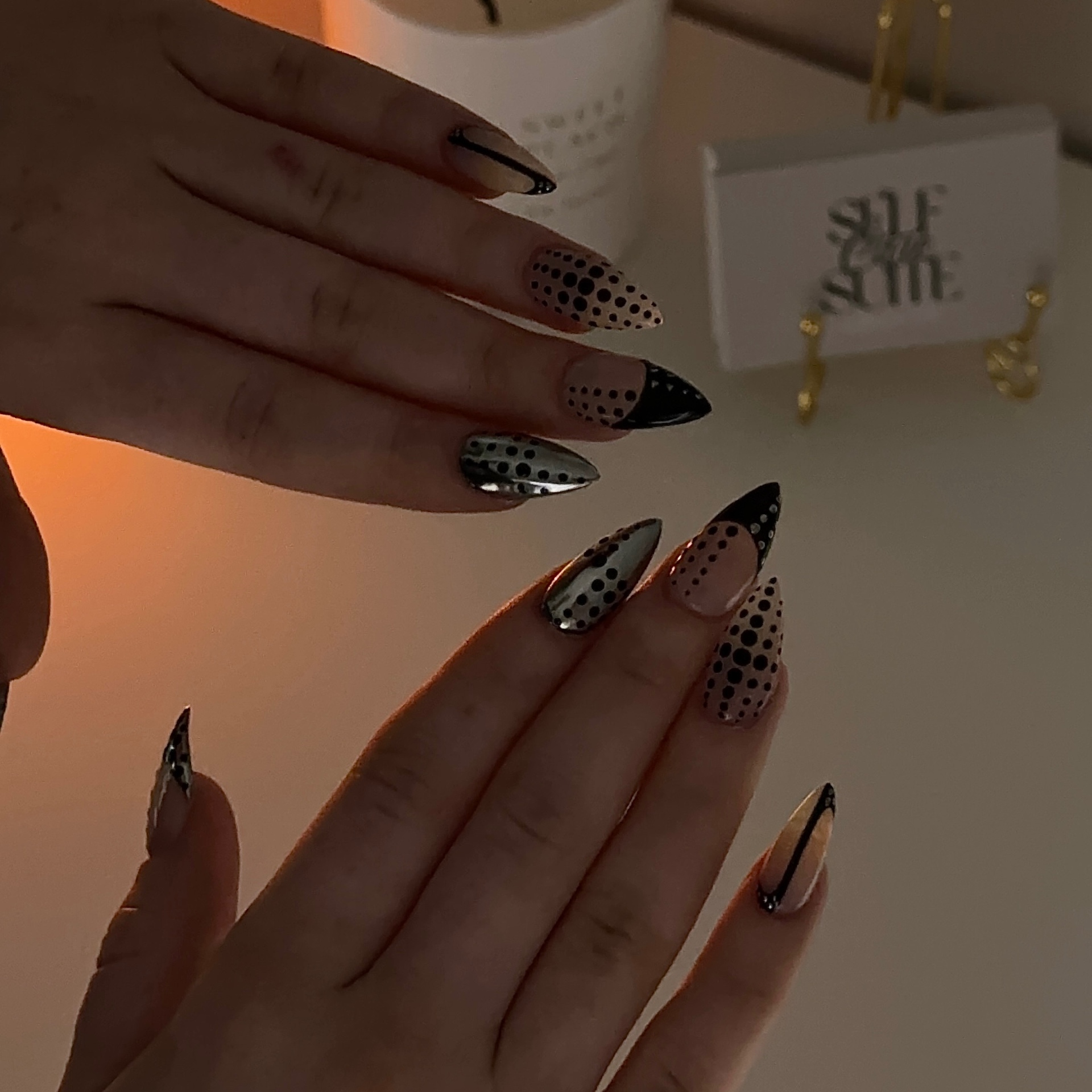 Editorial polka dot and chrome nail art by The Self Care Suite